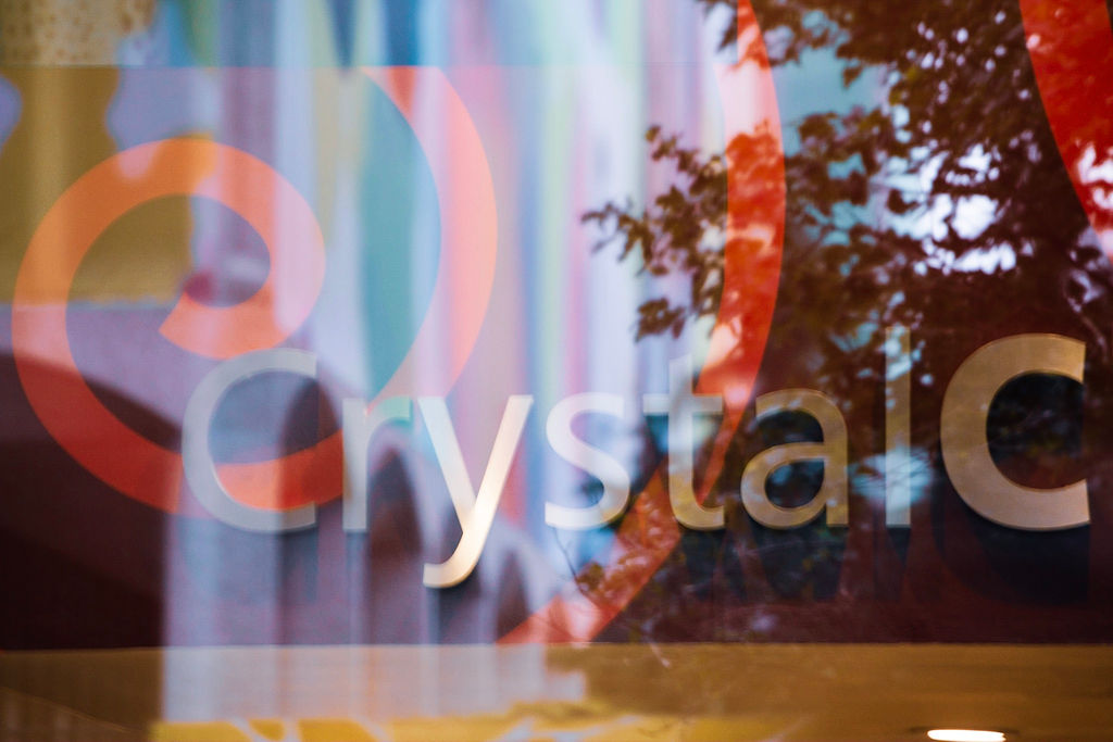 Crystal City signage layered with colorful glass reflections