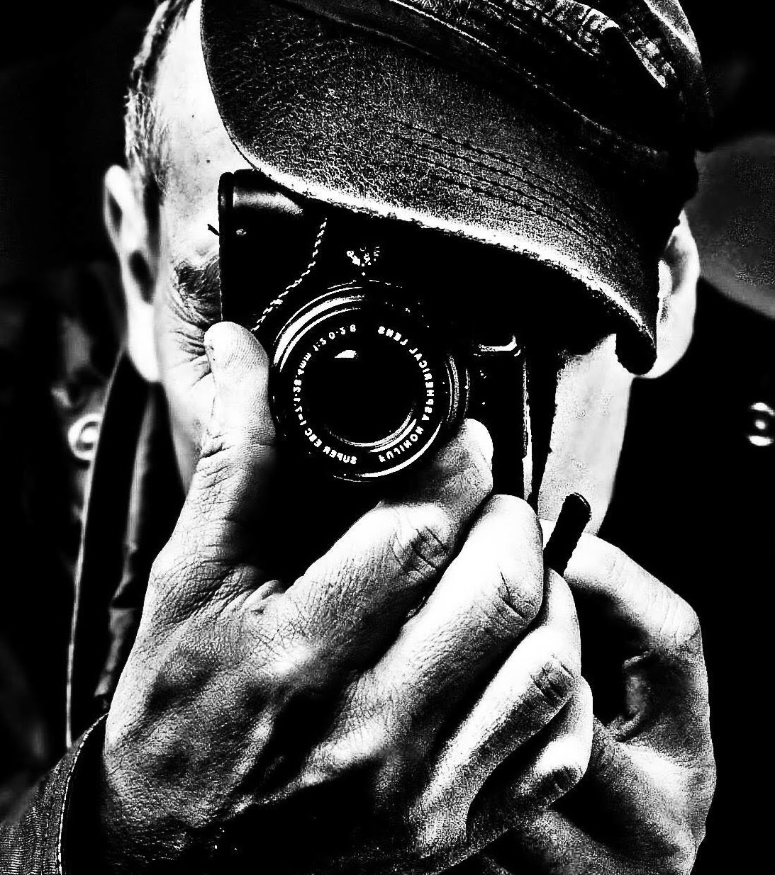 Doug Sanford photographing with a camera